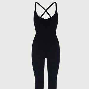 Jumpsuit flatters your shape. V-neckline and shoulder straps that crisscrosses.